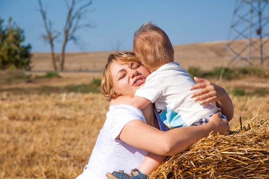 Live emotions of mother and son. A small child and a woman experience the feelings of love of mother and son.Family.