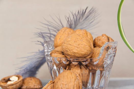 Walnuts in a shell in a crystal vase. Healthy nuts. Walnuts. 