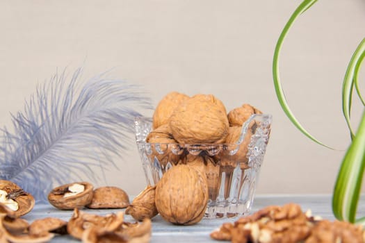 Walnuts in a shell in a crystal vase. Healthy nuts. Walnuts.  