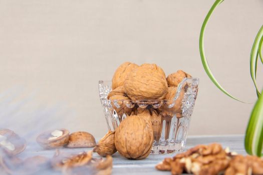 Walnuts in a shell in a crystal vase. Healthy nuts. Walnuts.