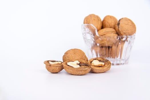 Walnuts in a shell on a white background. Healthy nuts. Walnuts.