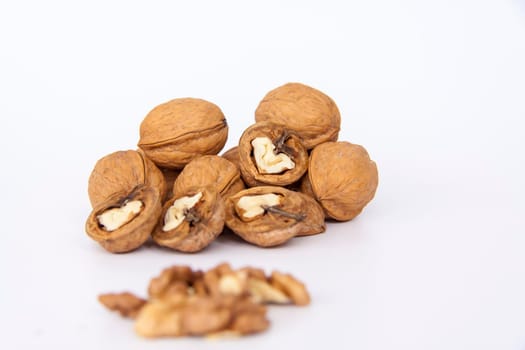 Walnuts in a shell on a white background. Healthy nuts. Walnuts. 