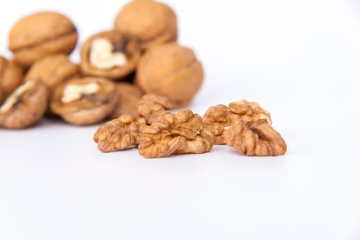 Walnuts in a shell on a white background. Healthy nuts. Walnuts.  