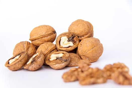 Walnuts in a shell on a white background. Healthy nuts. Walnuts. 