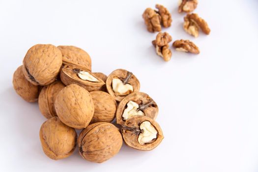 Walnuts in a shell on a white background. Healthy nuts. Walnuts. 