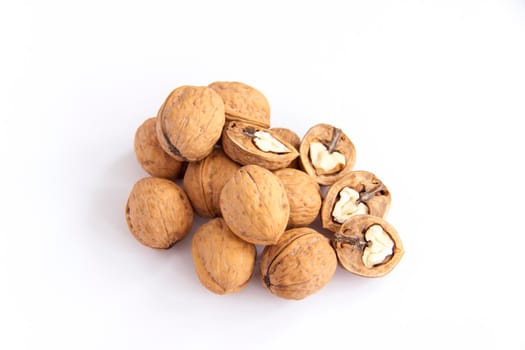 Walnuts in a shell on a white background. Healthy nuts. Walnuts.