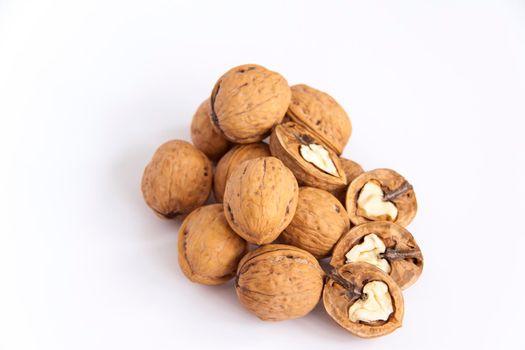 Walnuts in a shell on a white background. Healthy nuts. Walnuts. 