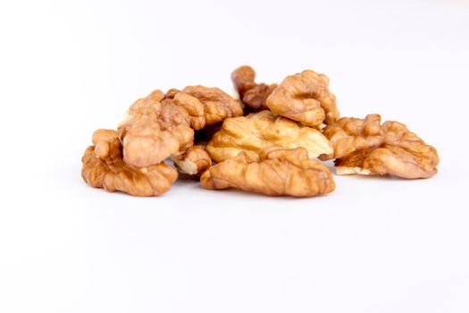 Walnuts without shells on a white background. Healthy nuts. Walnuts.