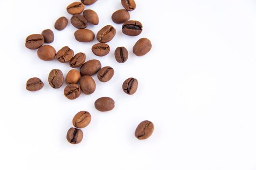 Coffee beans on a white background. Roasted coffee beans. Coffee.