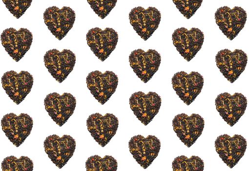 colorful pattern of tea hearts on a black background top view. High quality photo