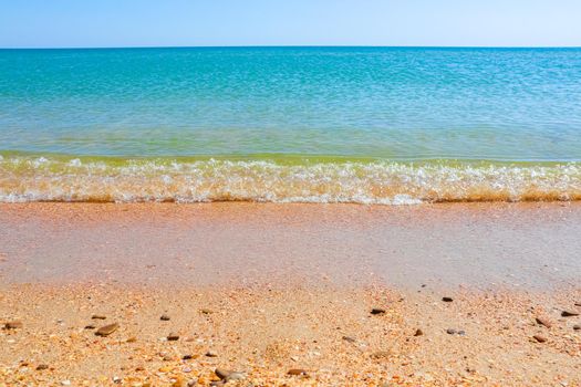 Soft Wave Of Blue Ocean On Sandy Beach. Background. Selective focus. High quality photo