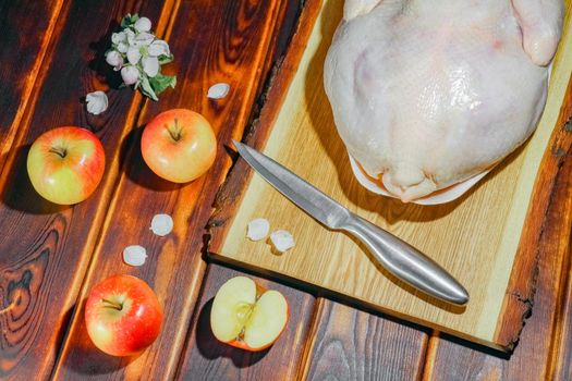 chicken with apples on a chopping Board. High quality photo