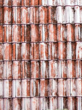 The old red tile on the roof