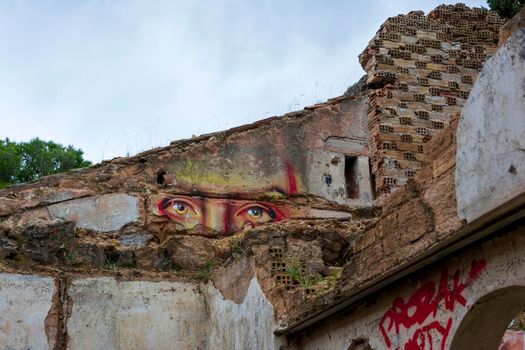 Eyes graffiti at an abandoned old villa at Pallini, Greece