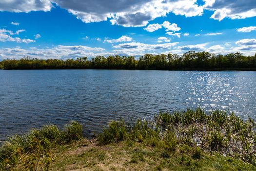 Coast of small peninsula on big Bajkal lake at sunny cloudy day