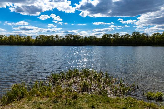 Coast of small peninsula on big Bajkal lake at sunny cloudy day