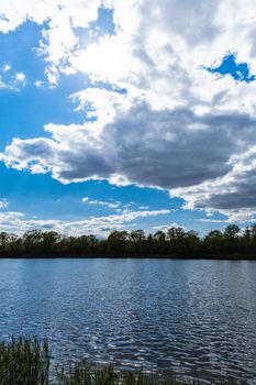 Coast of small peninsula on big Bajkal lake at sunny cloudy day