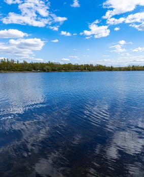 Vertical landscape of big Bajkal lake at sunny cloudy day at coast of peninsula