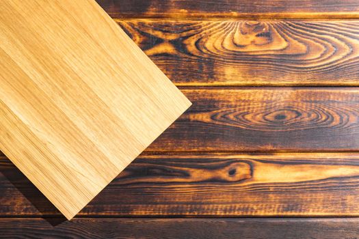 cutting Board on a wooden background top view. High quality photo