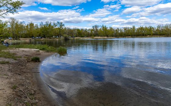 Coast of small peninsula on big Bajkal lake at sunny cloudy day