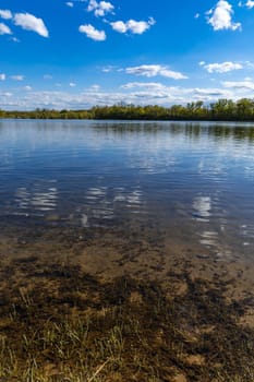 Vertical landscape of big Bajkal lake at sunny cloudy day at coast of peninsula