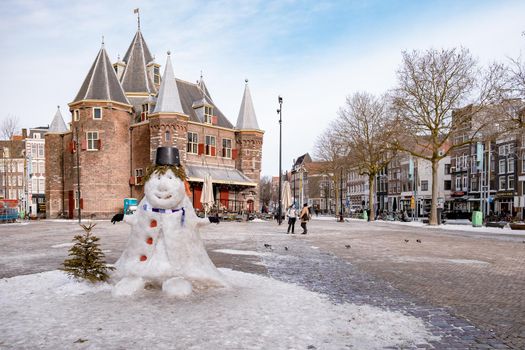 Amsterdam during winter with snowy streets. Amsterdam Netherlands February 2021