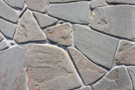 masonry wall paving stones as a background close up. High quality photo