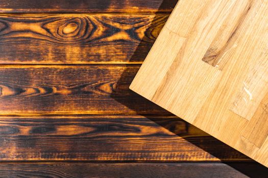 cutting Board on a wooden background top view. High quality photo