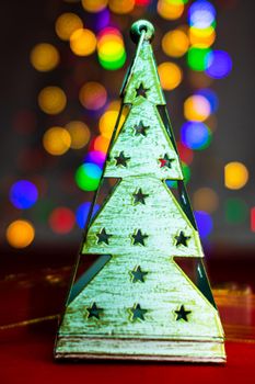 Blurred lights in Christmas composition with seasonal decorations and ornaments, colorful Christmas background christmassy mood concept.