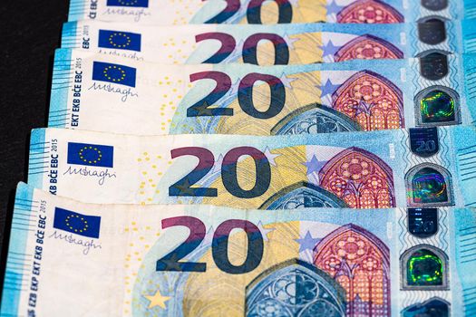 Selective focus on detail of euro banknotes. Close up macro detail of money banknotes, 20 euro isolated. World money concept, inflation and economy concept