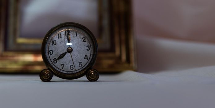 Vintage clock with white background and gold frame