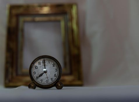 Vintage clock with white background and gold frame