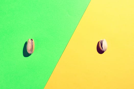 pistachios on a multicolored background top view. High quality photo