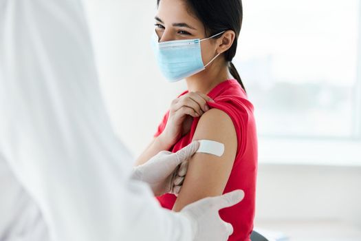 woman wearing medical mask patient injection coronavirus. High quality photo