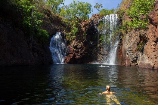 Litchfield National Park, Northern Territory, Australia - Jun 12 2013: Tourists and residents of Darwin enjoy refreshing swim at Florence Falls, very popular desitination for tourists and locals alike