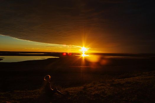 jung women enjoying beautiful sunset in the australian outback with 3 lakes, Gladstone scenic lookout