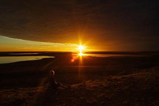 jung women enjoying beautiful sunset in the australian outback with 3 lakes, Gladstone scenic lookout