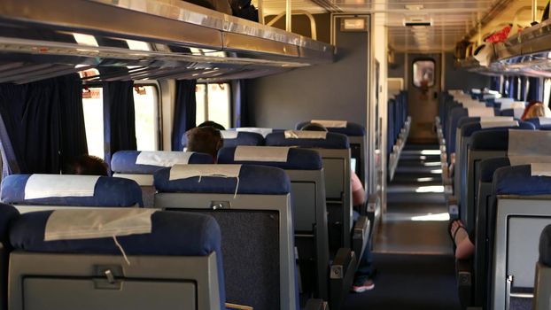 LOS ANGELES, CALIFORNIA, USA - 24 OCT 2019: Amtrak Pacific Surfliner commuter, express train car inside. Passenger rapid rail transportation along the ocean. Railway on west coast. Railroad in suburb.