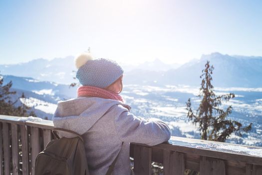 Back of young woman enjoying the view over the mountains, outlook. Gaisberg, Austria
