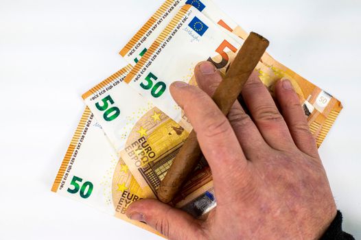 50 euro bills with man hand holding cigar on white background