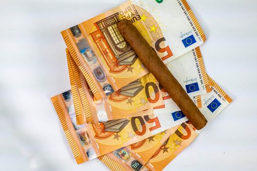 50 euro bills with cigar on white background