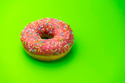donut donuts on a green background close-up. isolate. High quality photo