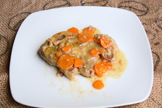 homemade marrowbone with the grandmother's recipe of carrots, celery, tomatoes and slow cooking