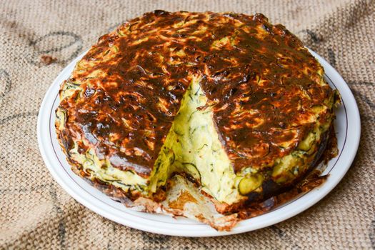 homemade savory cake with zucchini, goat cheese, ricotta, eggs and the wisdom of the grandmother