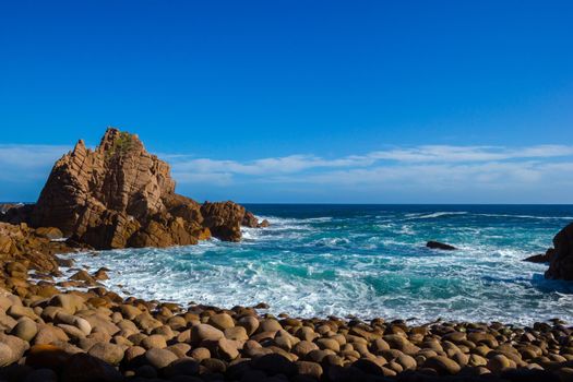 nice rock beach at philip island on a sunny day, australia