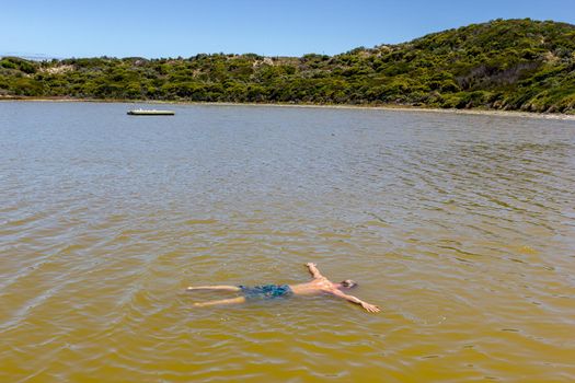 Man floating like dead in a salt sea, south Australia, Australia