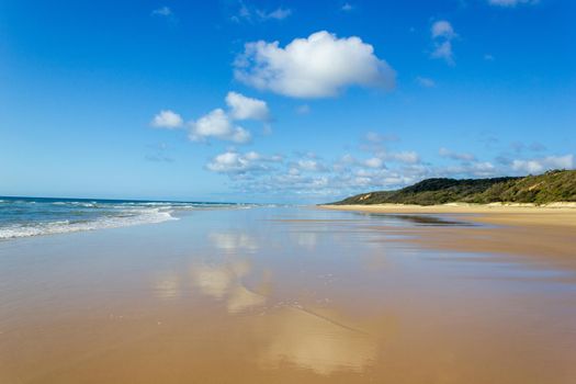 Main transportation highway on Fraser Island - wide wet sand beach coast facing Pacific ocean - long 75 miles beach.