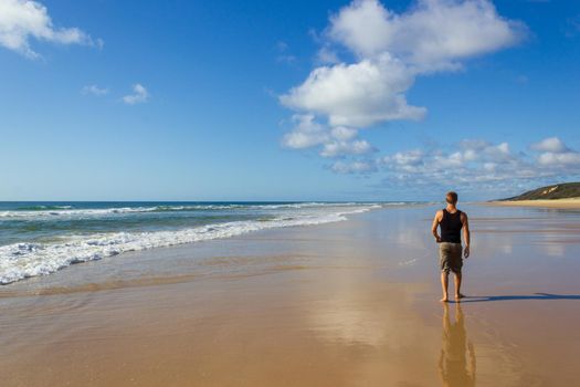 Main transportation highway on Fraser Island - wide wet sand beach coast facing Pacific ocean - long 75 miles beach.