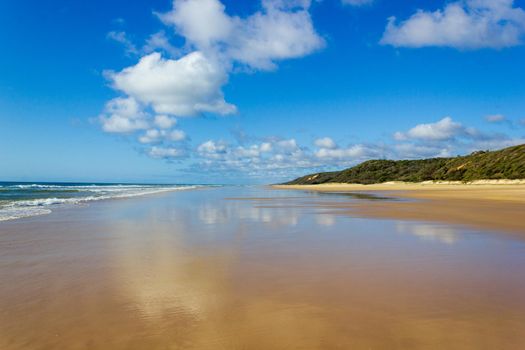 Main transportation highway on Fraser Island - wide wet sand beach coast facing Pacific ocean - long 75 miles beach.