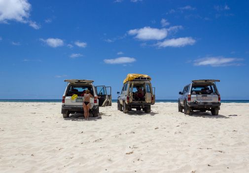 Main transportation highway on Fraser Island - wide wet sand beach coast facing Pacific ocean - long 75 miles beach.